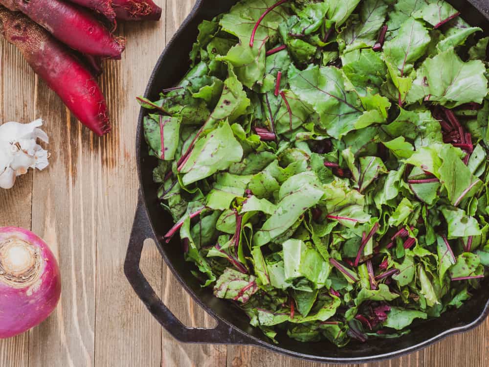 Beet greens in a cast iron skillet
