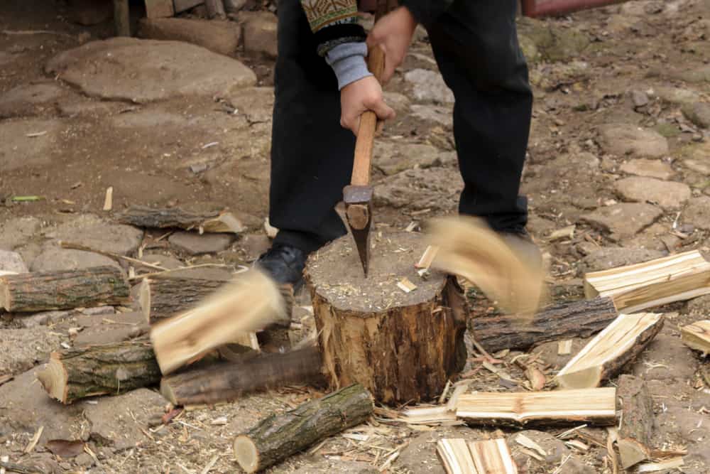 Chopping firewood with an axe