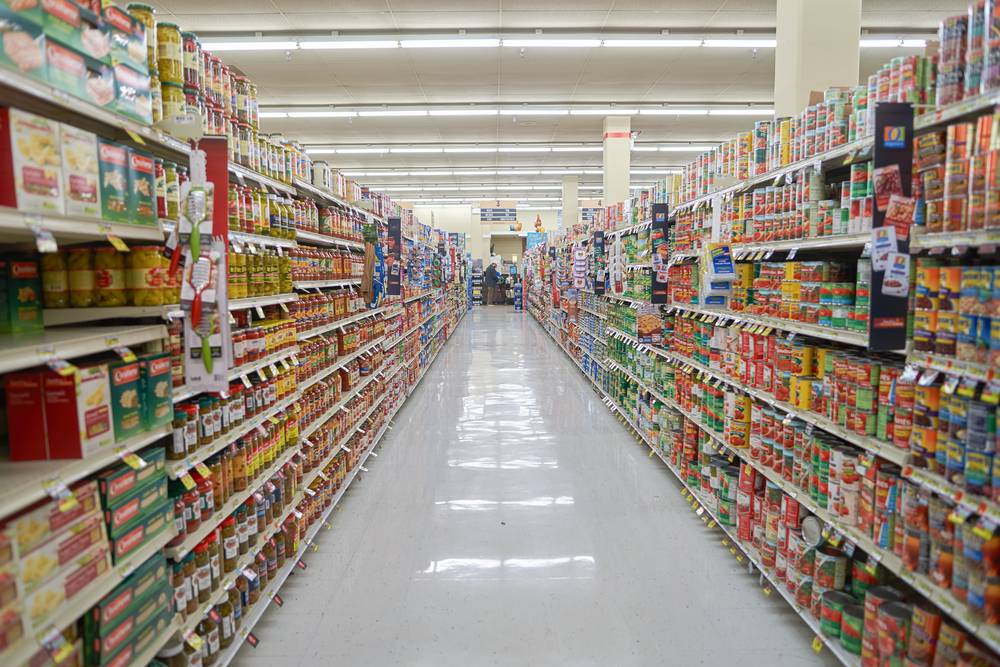 Aisles of a grocery store filled with food.