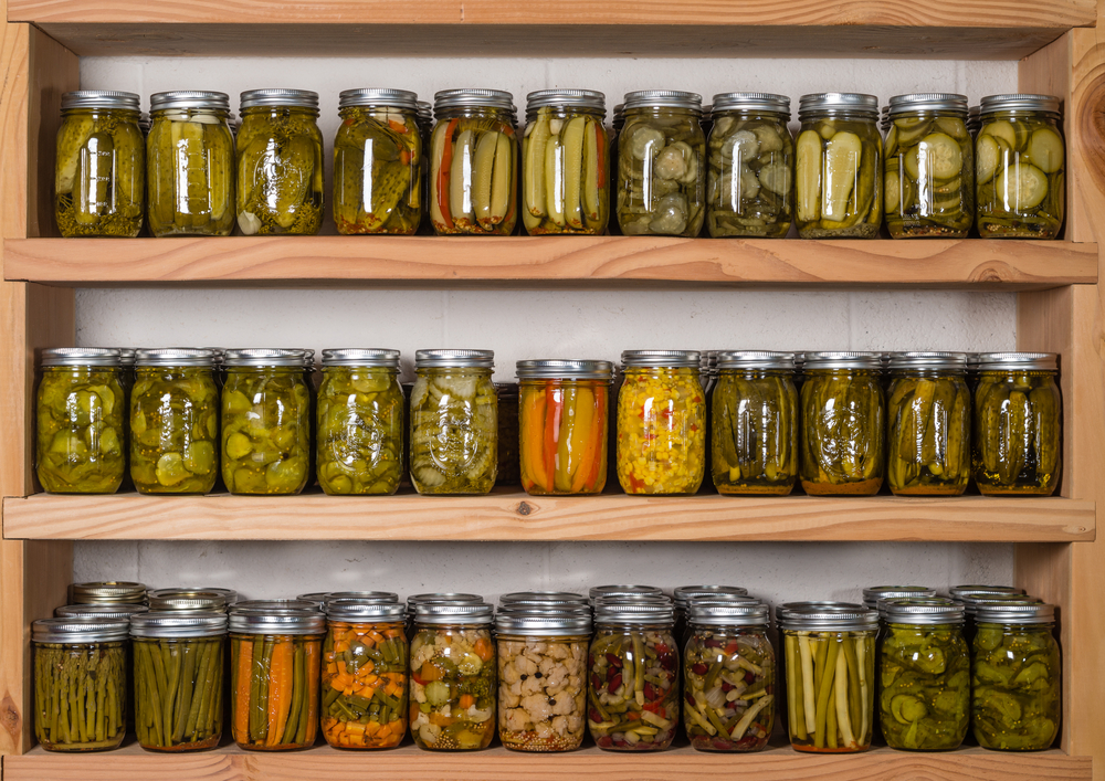 Several shelves filled with canned vegetables.