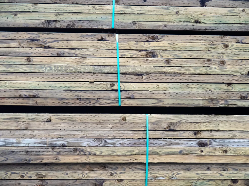Stacks of pressure treated lumber. 