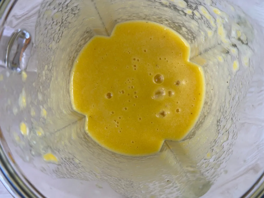 Close up of hollandaise sauce in a blender.
