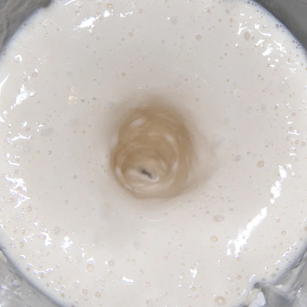 Pancake batter being blended in a blender.