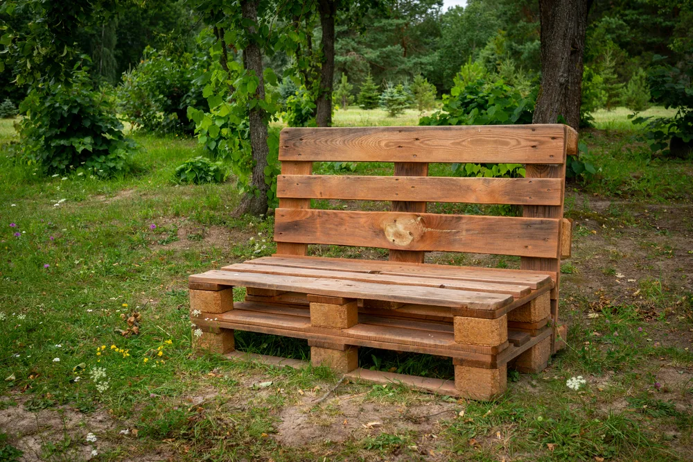 A wood bench made of reclaimed pallets
