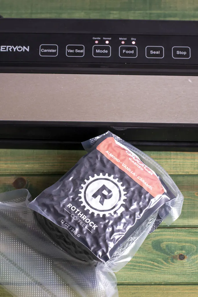 A bag of coffee is sealed in a bag ready to be frozen.