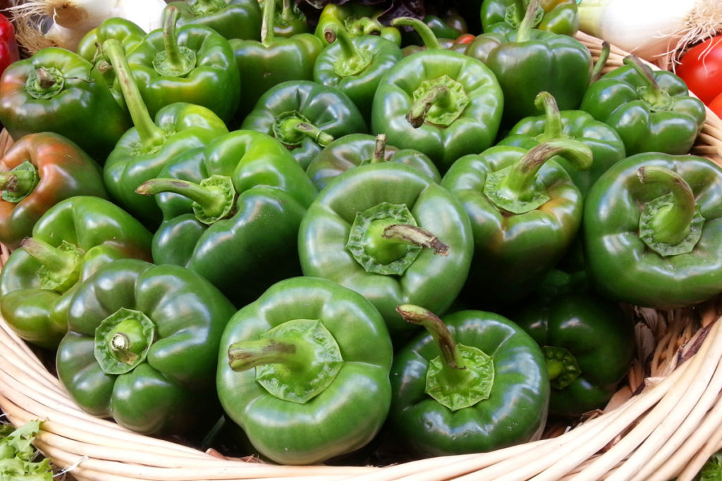 A basket of green bell peppers.
