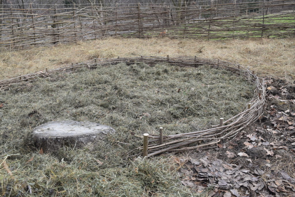 No-dig garden covered with leaves, hay and grass. 