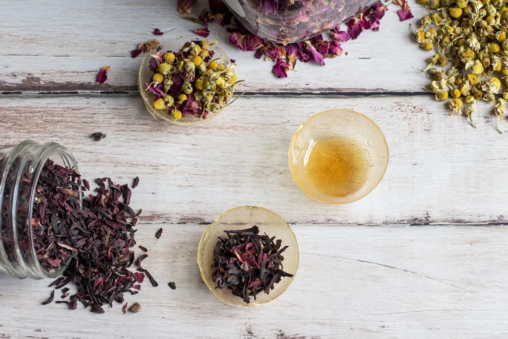 Tea bomb shells filled with hibiscus flowers, rose petals and chamomile buds.