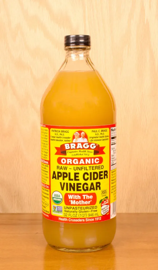 A close up of a jar of Bragg Organic Apple Cider Vinegar.