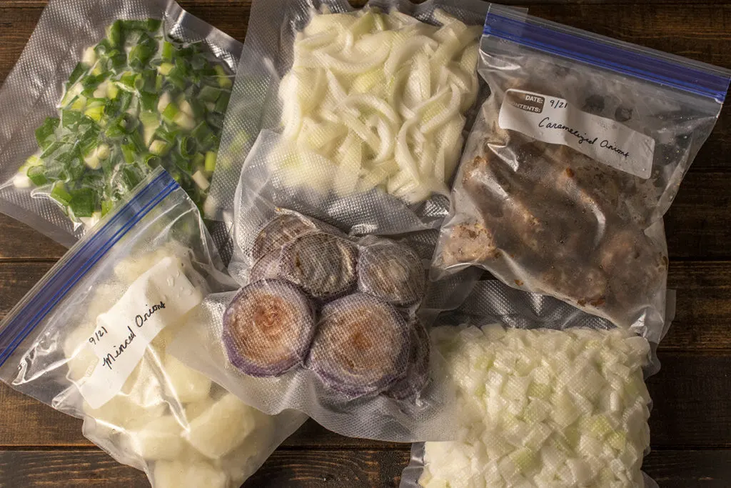 Overhead view of bags of different frozen onions
