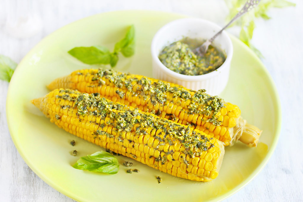 Sweetcorn on the cob with herbed butter.