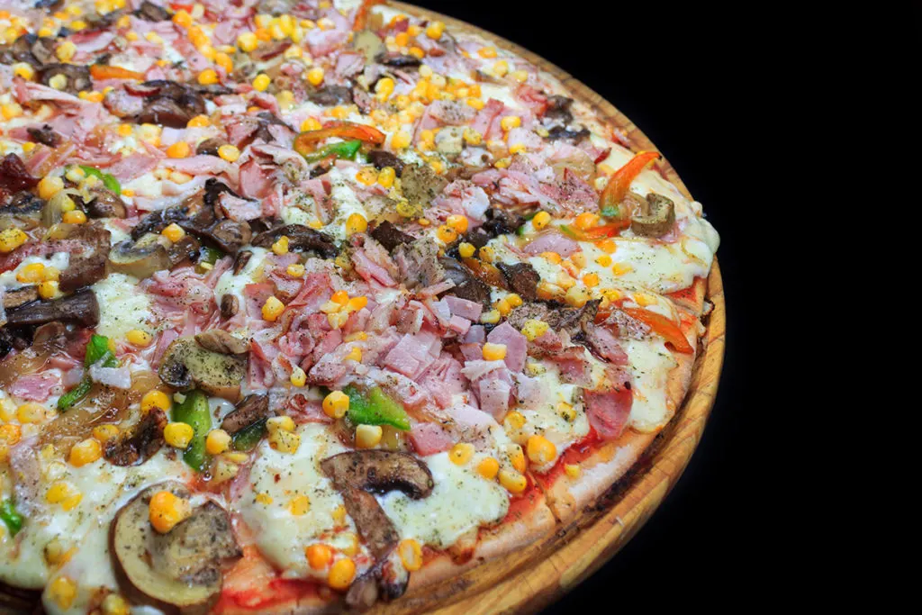 pizza with ham corn and mushrooms