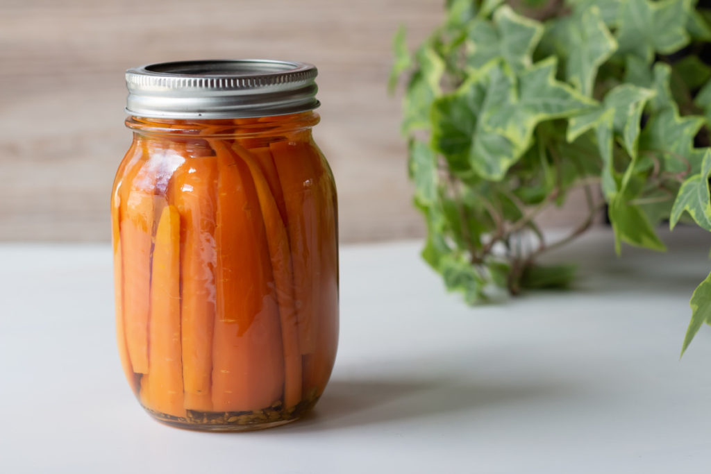 A jar of canned carrots. 