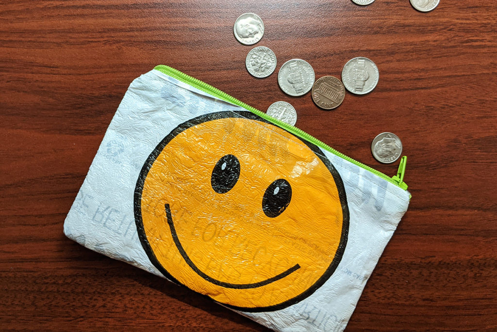 Plastic bag coin purse with a smiley face on it.
