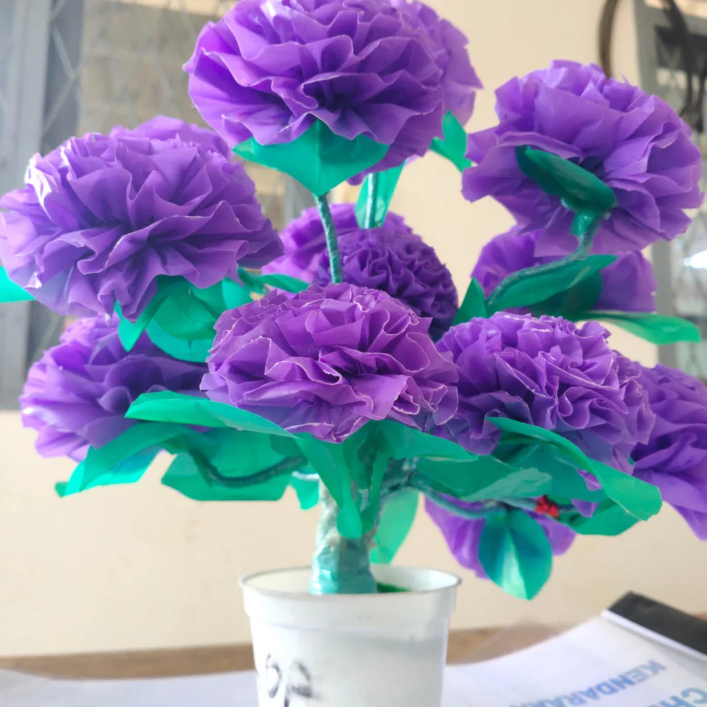 Tissue paper flowers made with a purple plastic bag instead of tissue