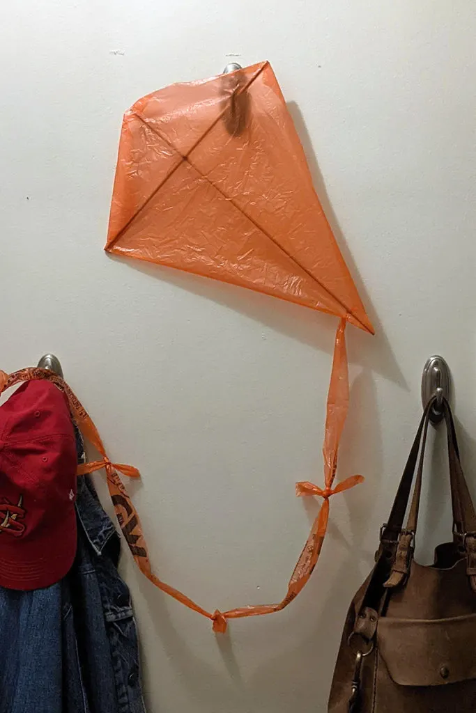A kite hanging on the wall.