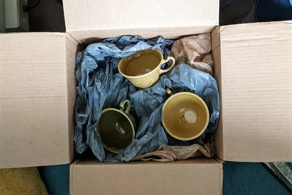 Cups packed for shipping in a box filled with plastic bags