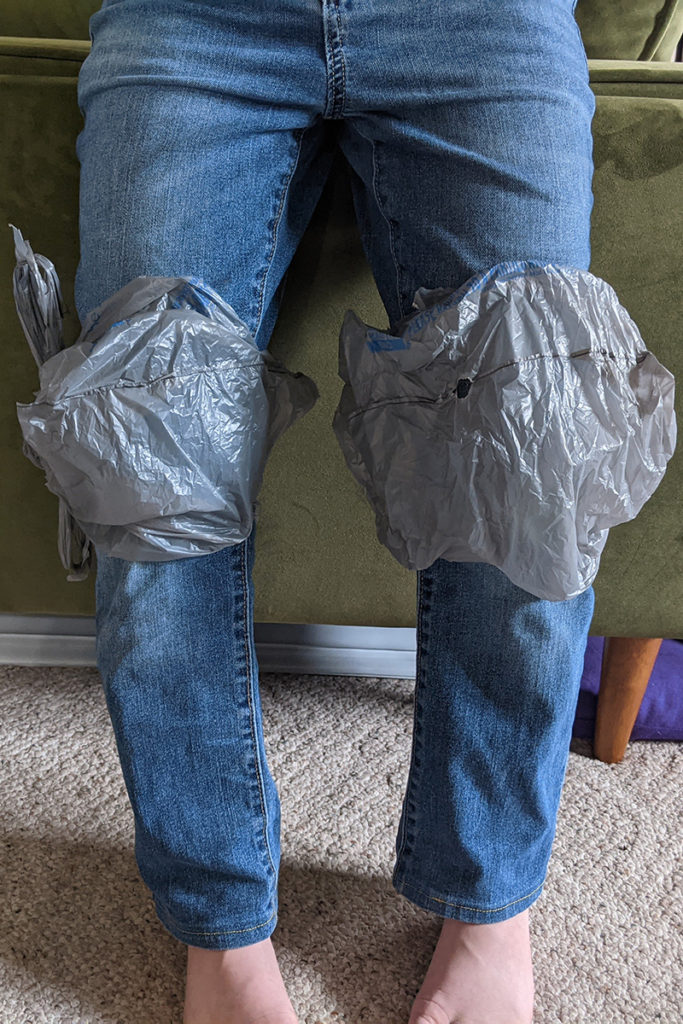 legs with plastic bags covering the knees.