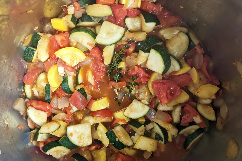 The tomatoes have been added to the ratatouille making for a lovely red, green and yellow mixture of vegetables.