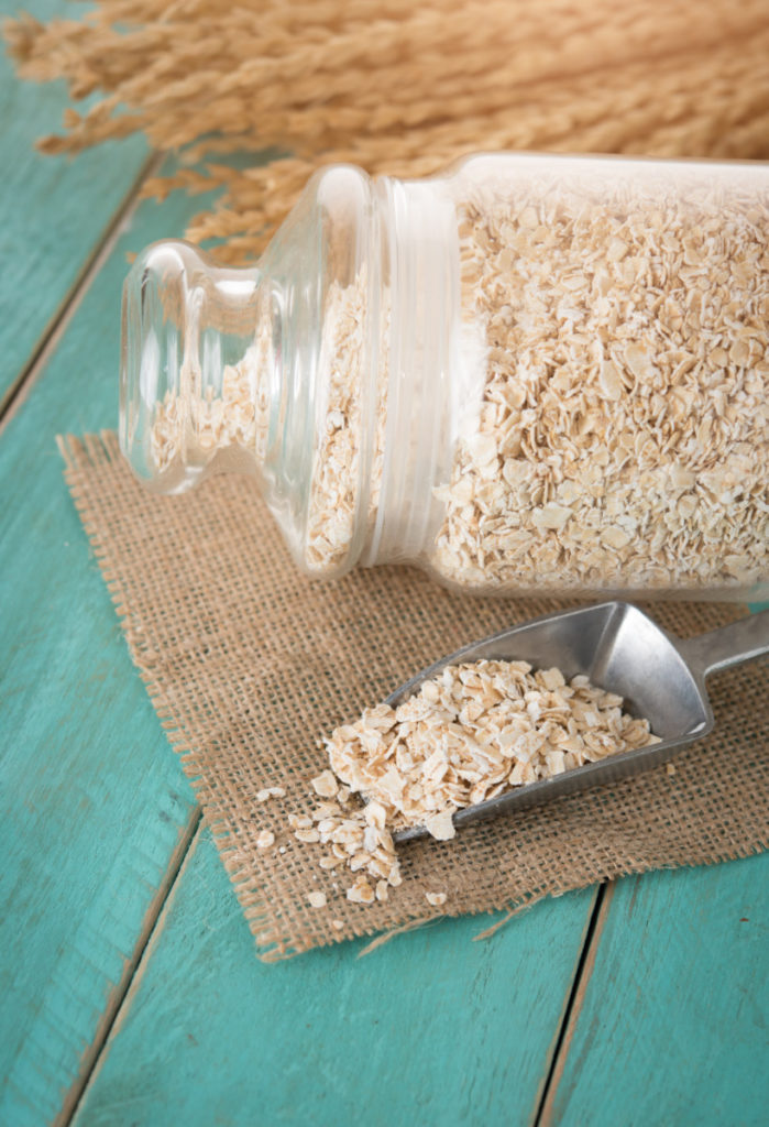 jar of rolled oats on a rustic background