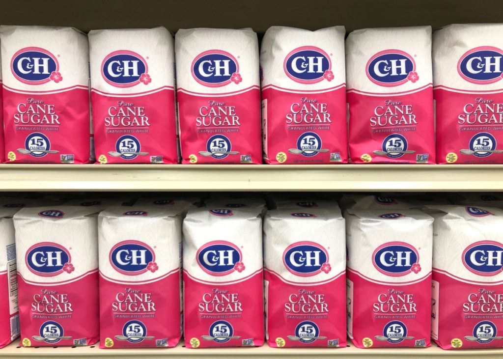 rows of bags of sugar at the store