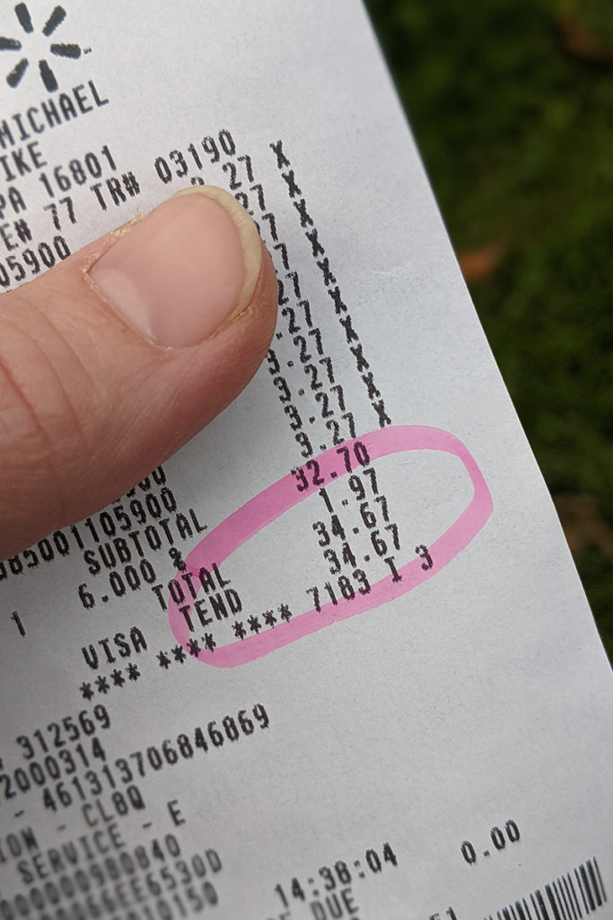 Close up photo of a receipt, $34.67 is circled in pink highlighter.