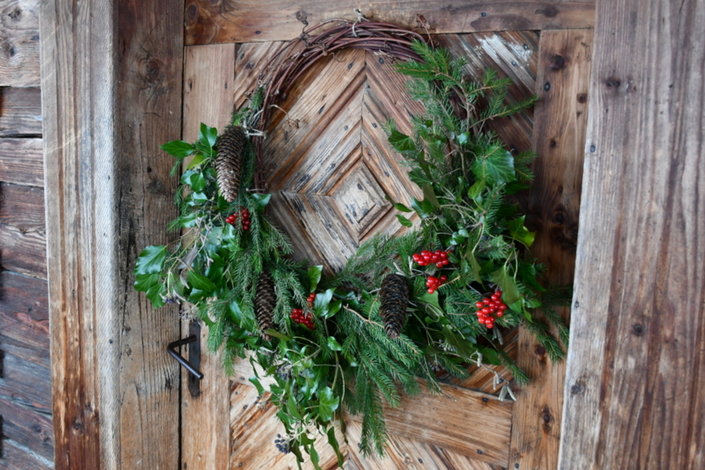 handmade Christmas wreath hanging on front door