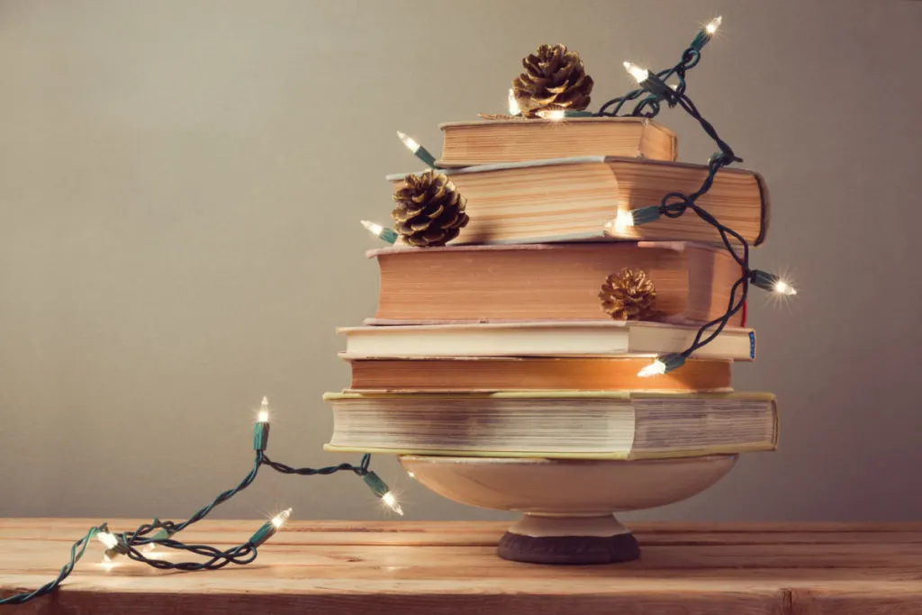 A stack of books to resemble a Christmas tree