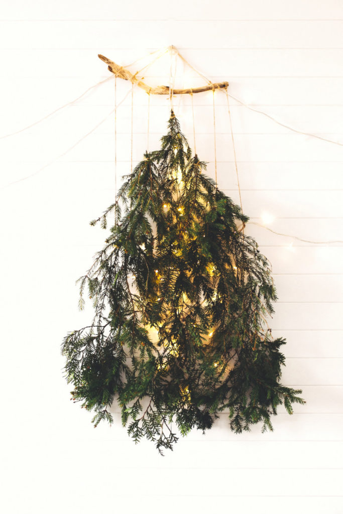 hanging evergreen boughs with Christmas lights