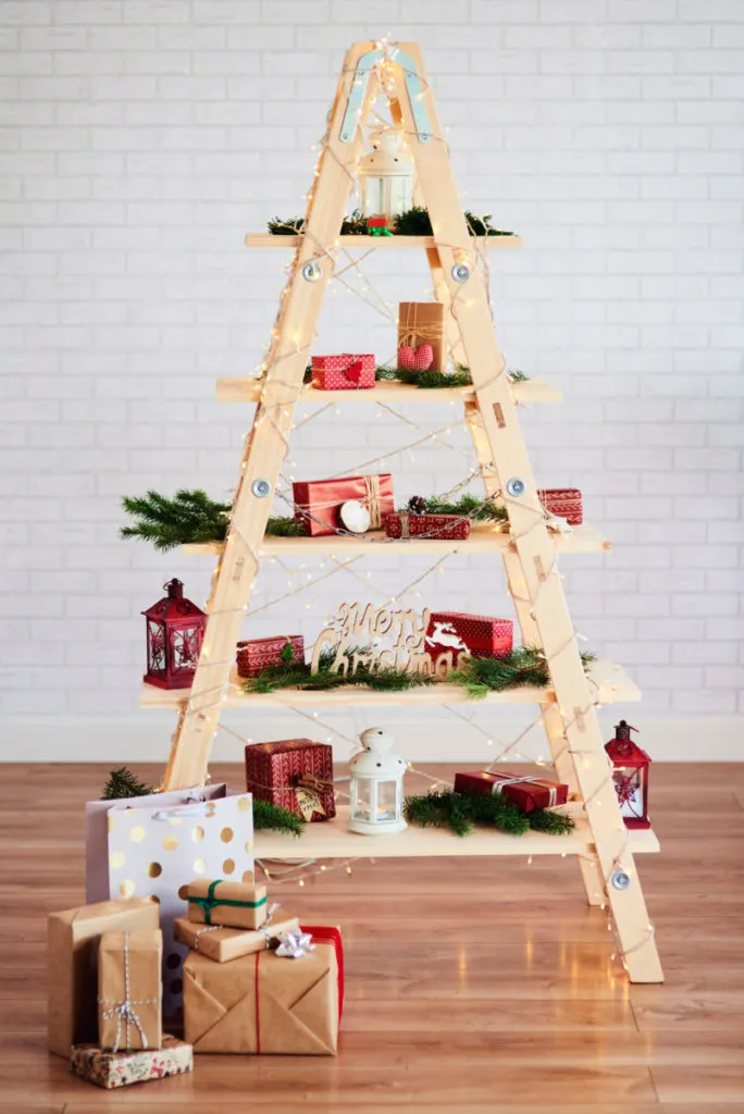 Step ladder made into a shelf and decorated for Christmas