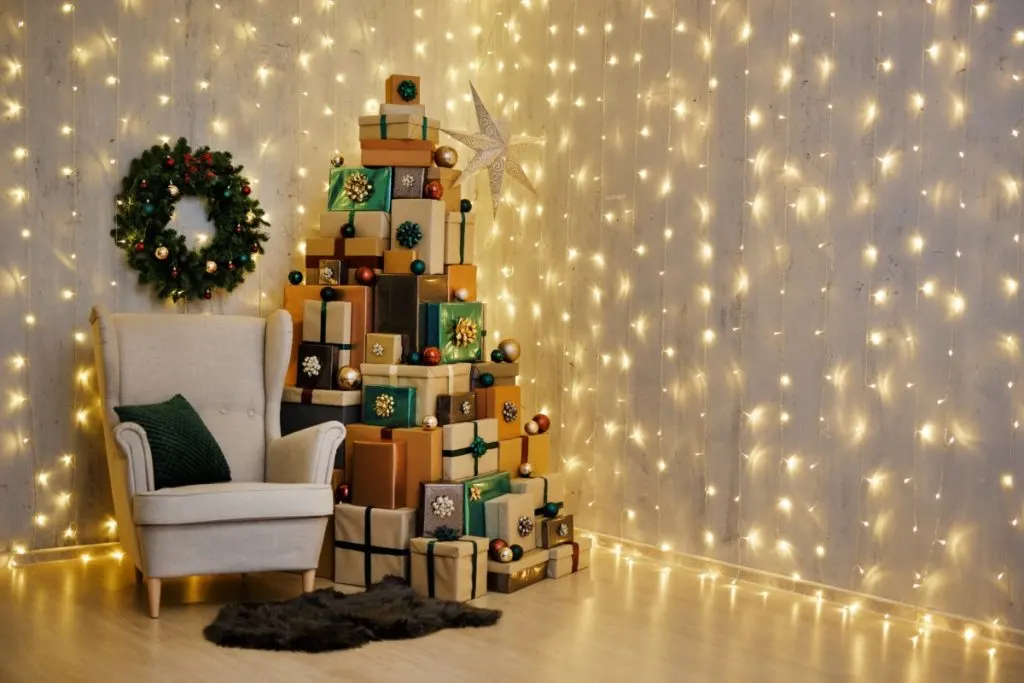 A pile of Christmas presents stacked in the shape of a tree