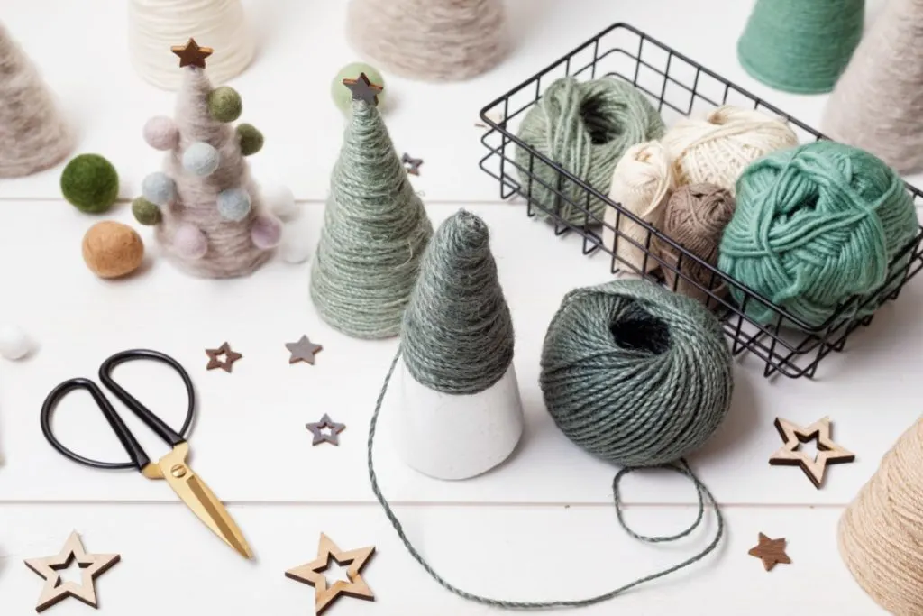 Making yarn Christmas trees with paper cones