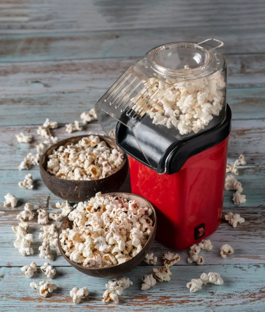 A red hot-air popcorn machine.