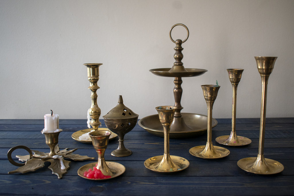 Collection of tarnished brass items.