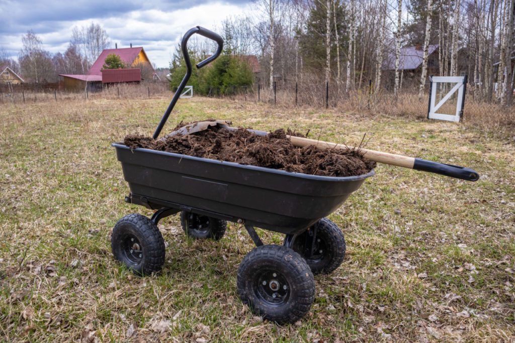 Garden cart filled with compost