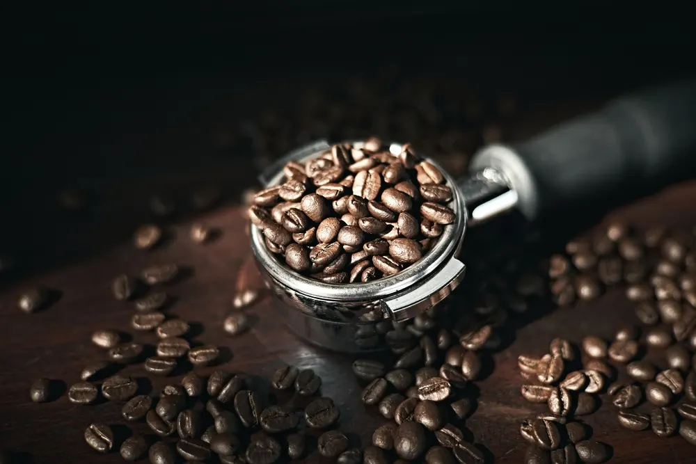 Coffee beans in espresso puck holder
