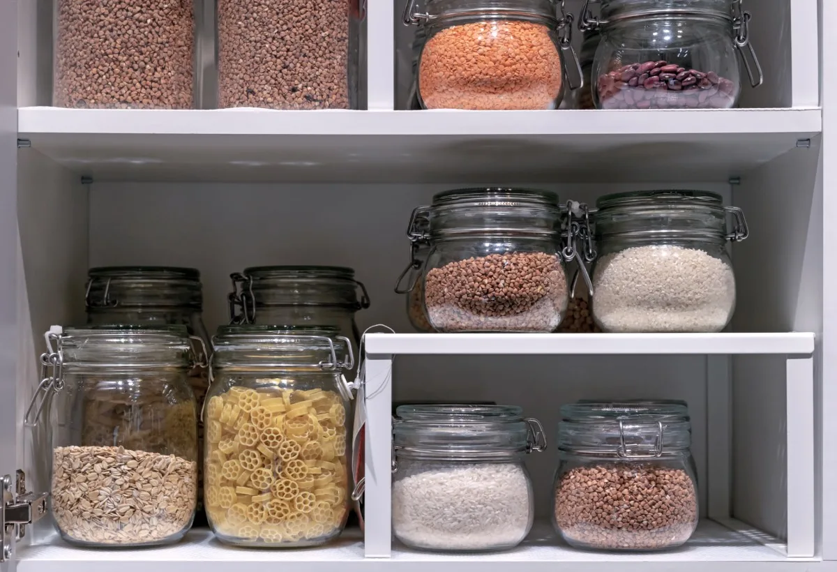Jars of dried good in a pantry.