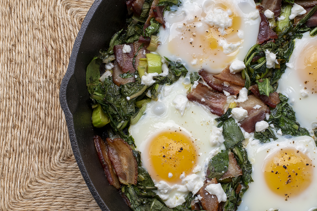 Dandelion green skillet with eggs and bacon