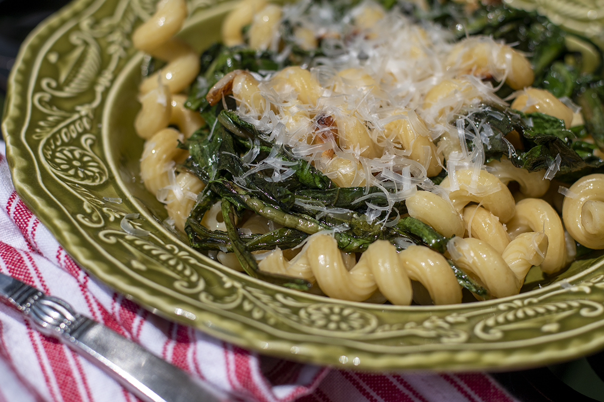 Pasta tossed with sauteed dandelion greens. 