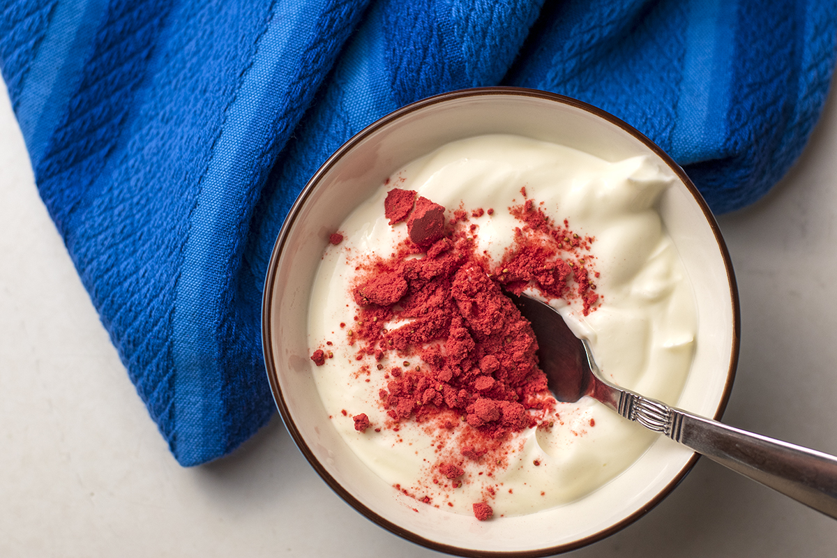 Plain yogurt with strawberry powder on top