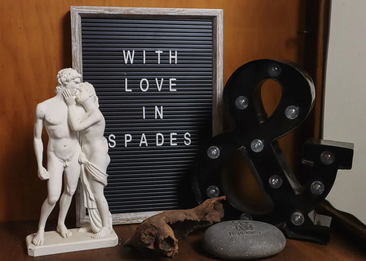Letter board, light and small marble statue.