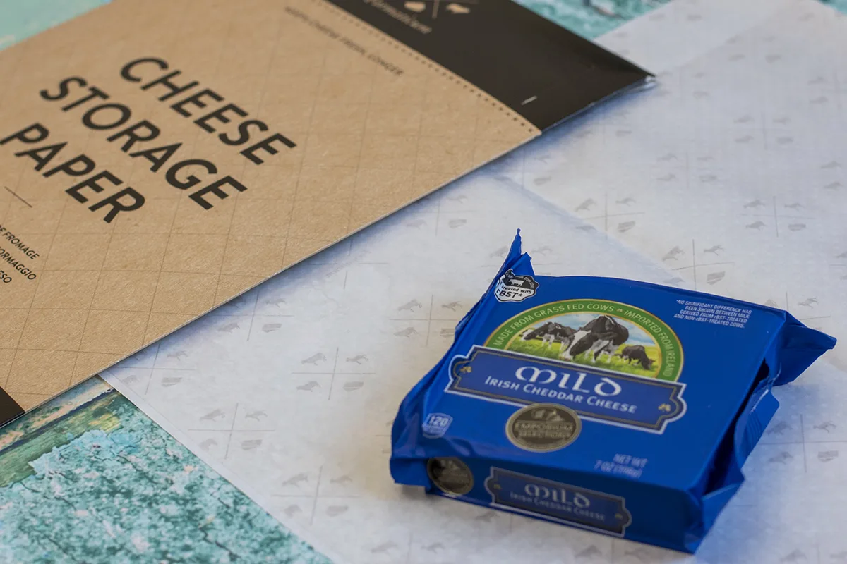 Cheese paper and a small package of mild Irish cheddar cheese