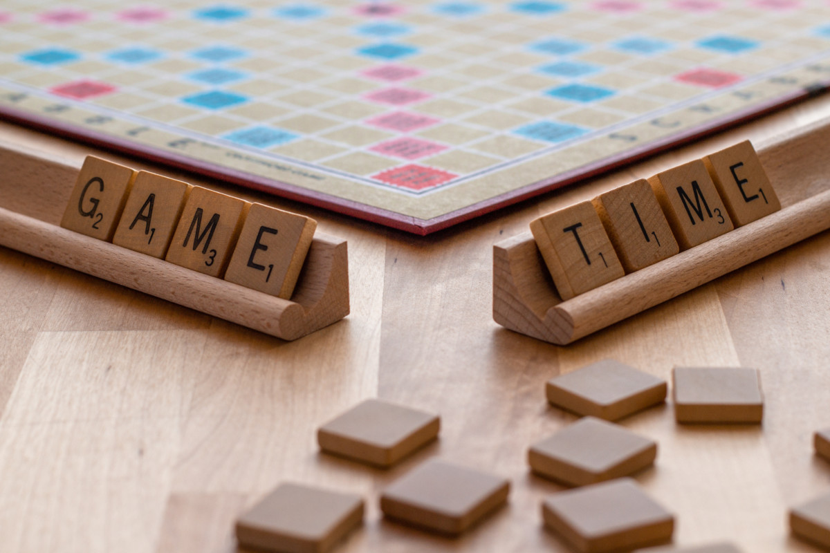Scrabbled pieces set up to read "Game Time"
