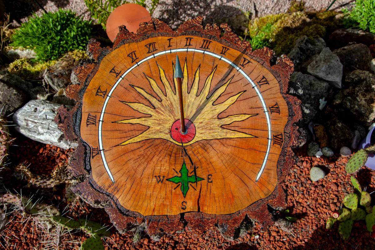 A sundial made from an old tree stump.