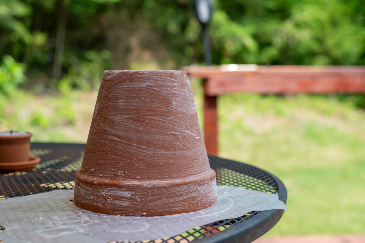 Terracotta pot painted with a baking soda paste.