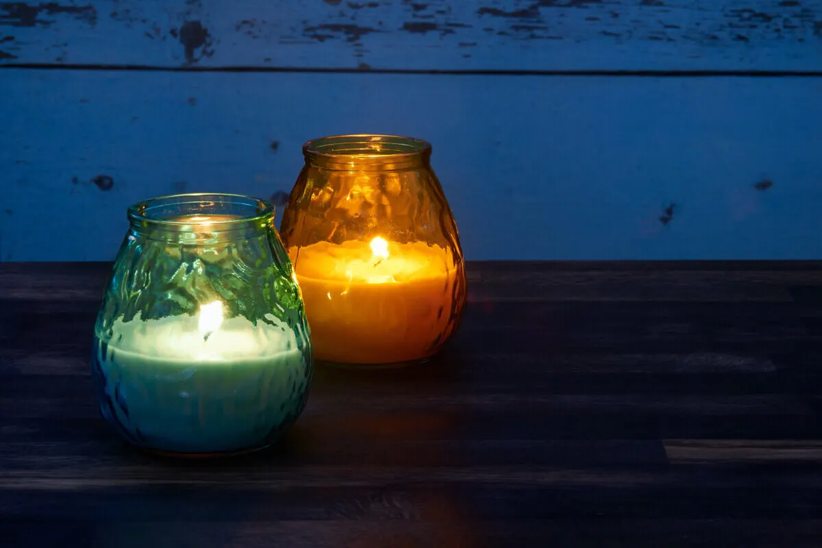 Two citronella candles in the dark