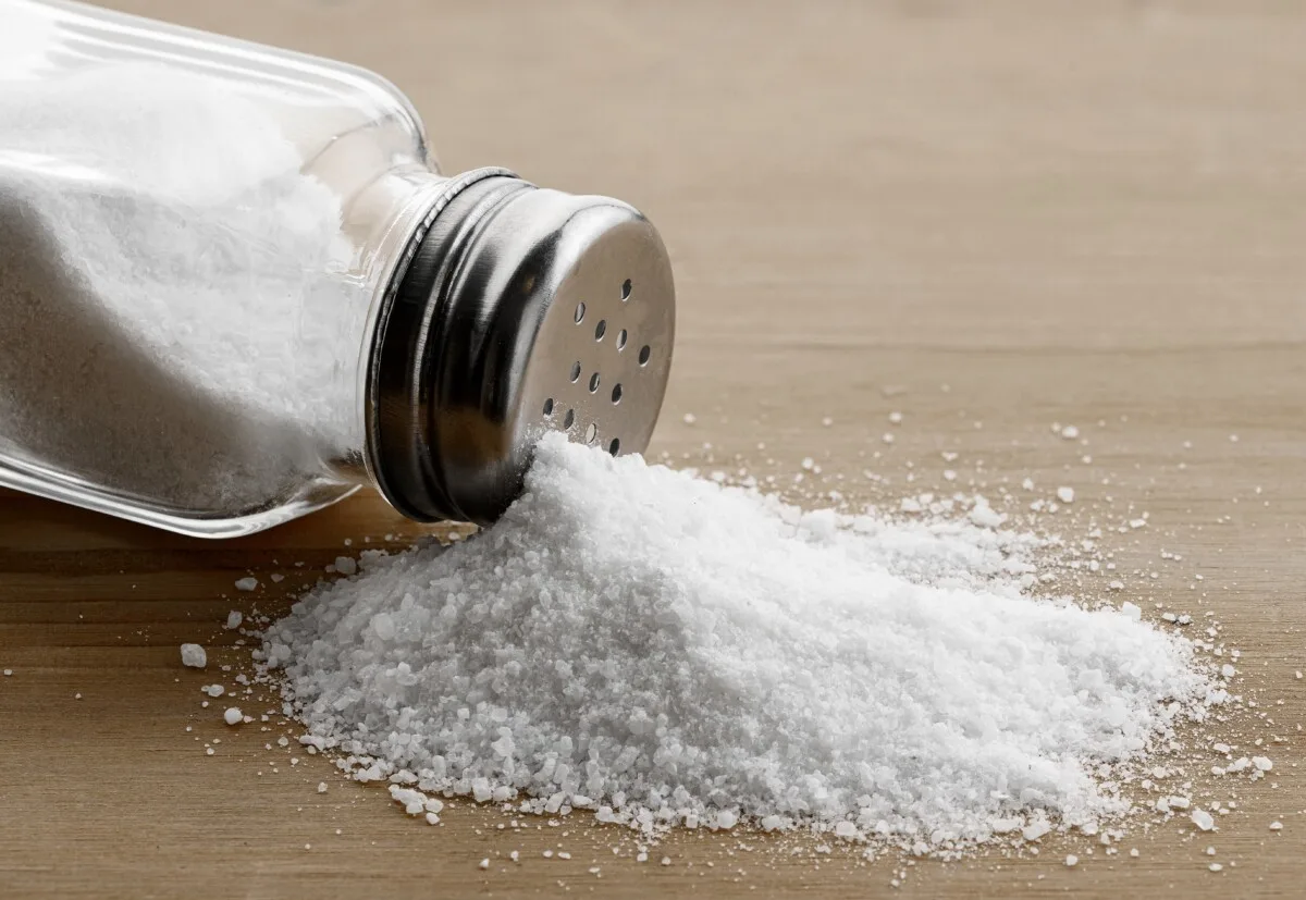 Spilled salt shaker on table
