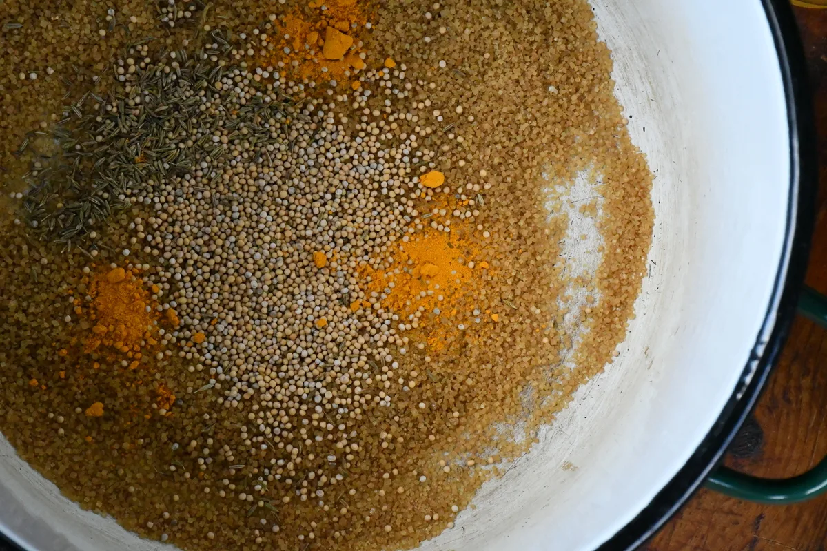 Overhead view of a bowl with spices and sugar in it.