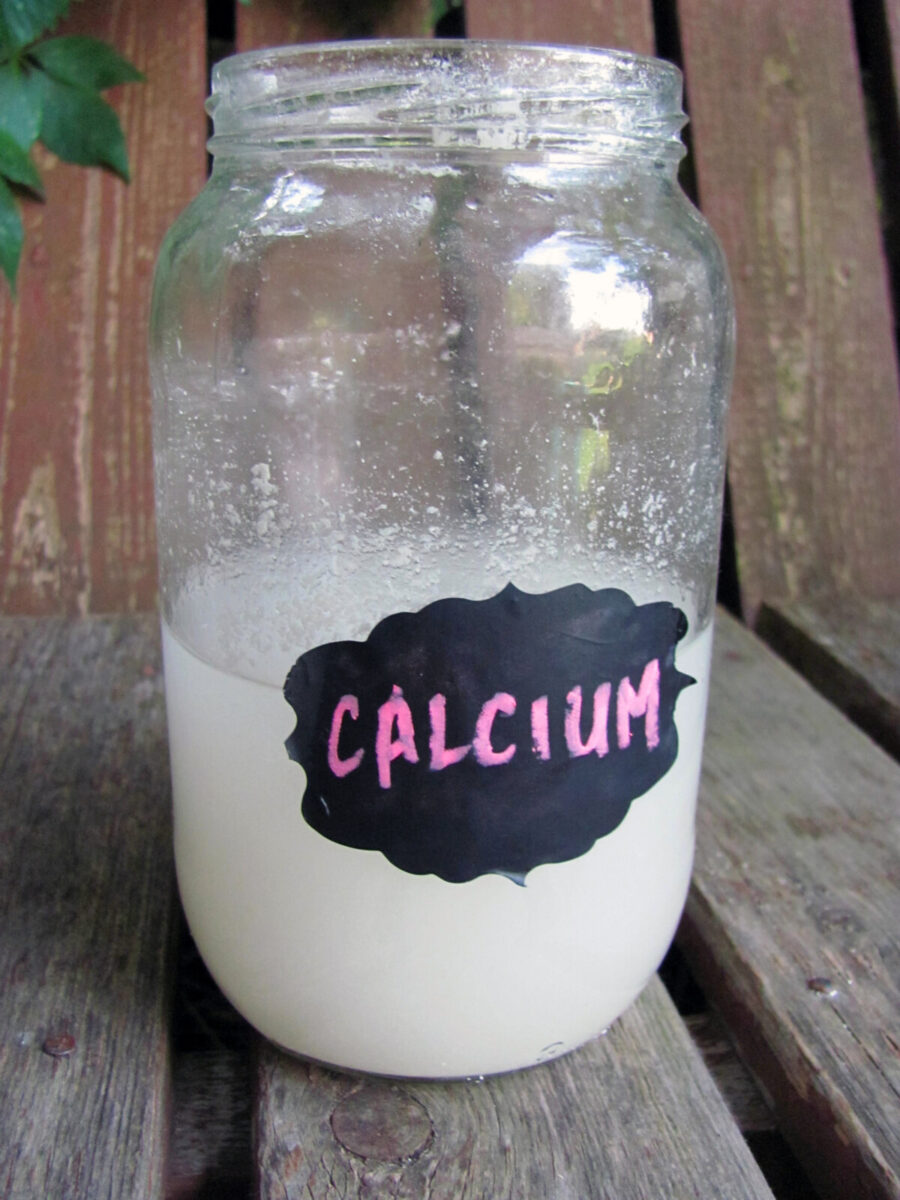 Jar labeled "Calcium" filled with milky white liquid