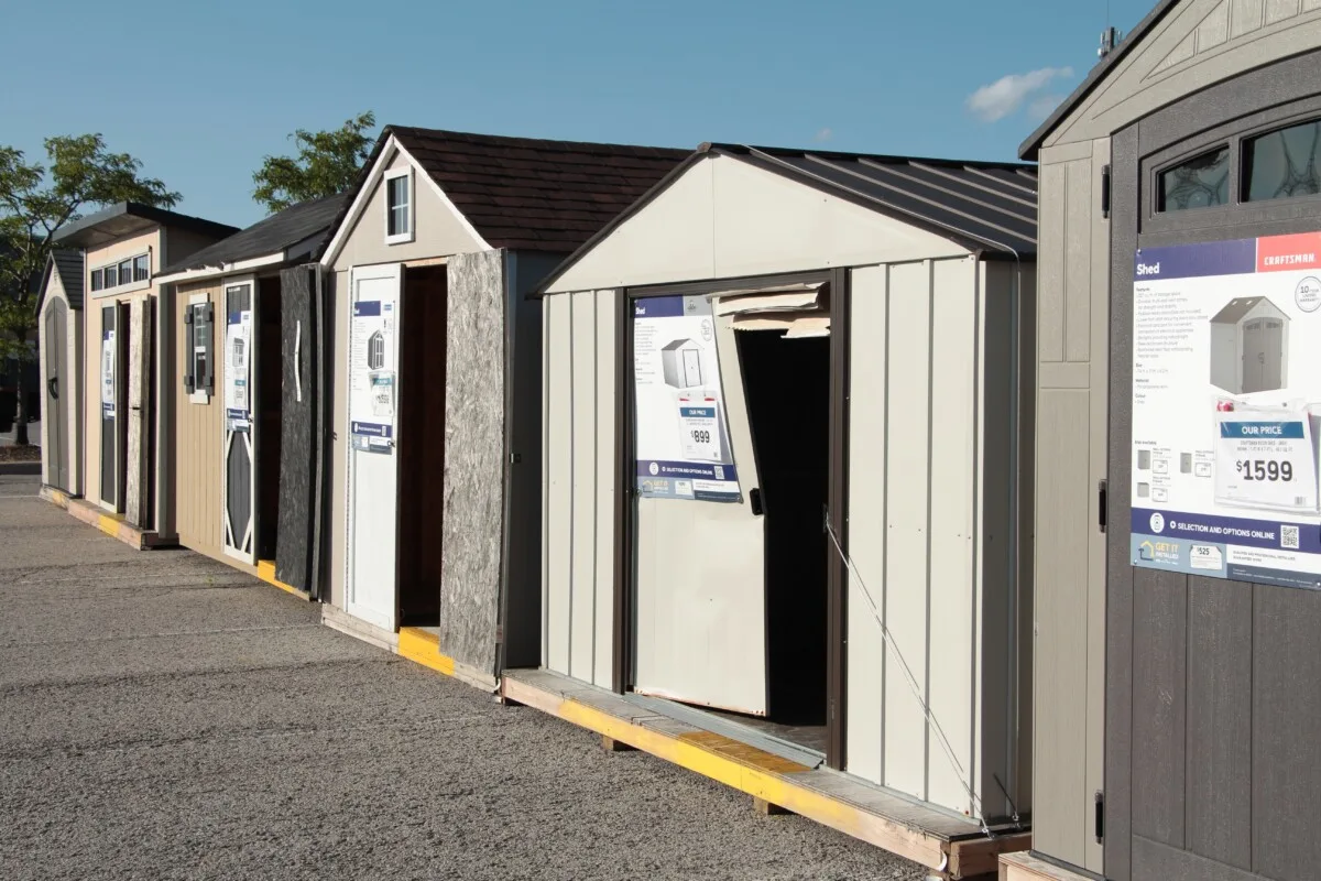 Row of prefab sheds in a store parking lot